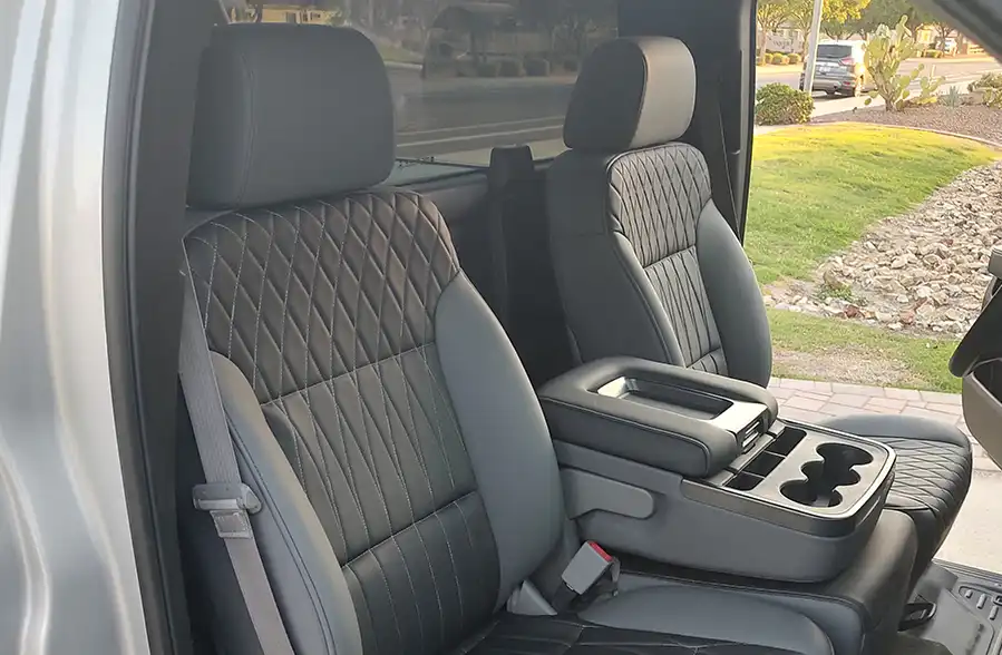 Custom truck interior with diamond-stitched leather seats and upgraded center console